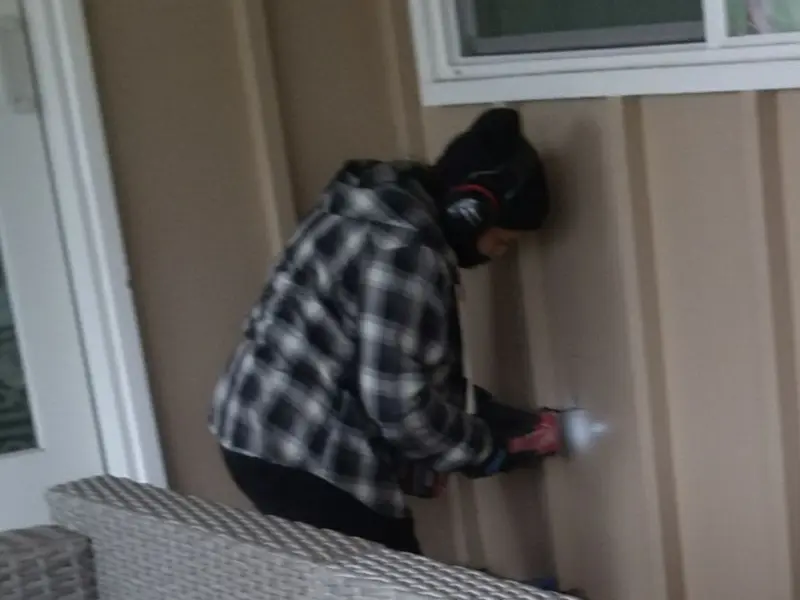 Professional electrician installing an exterior outlet in Logansport